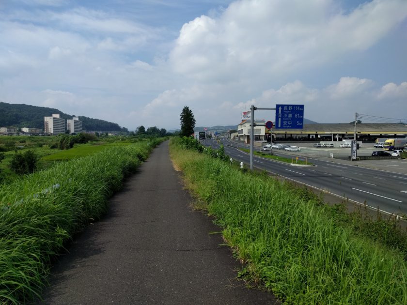 River to the left, Route 18 (and old Nakasendo, apparently) to the right. Mountains ahead, Takasaki behind.